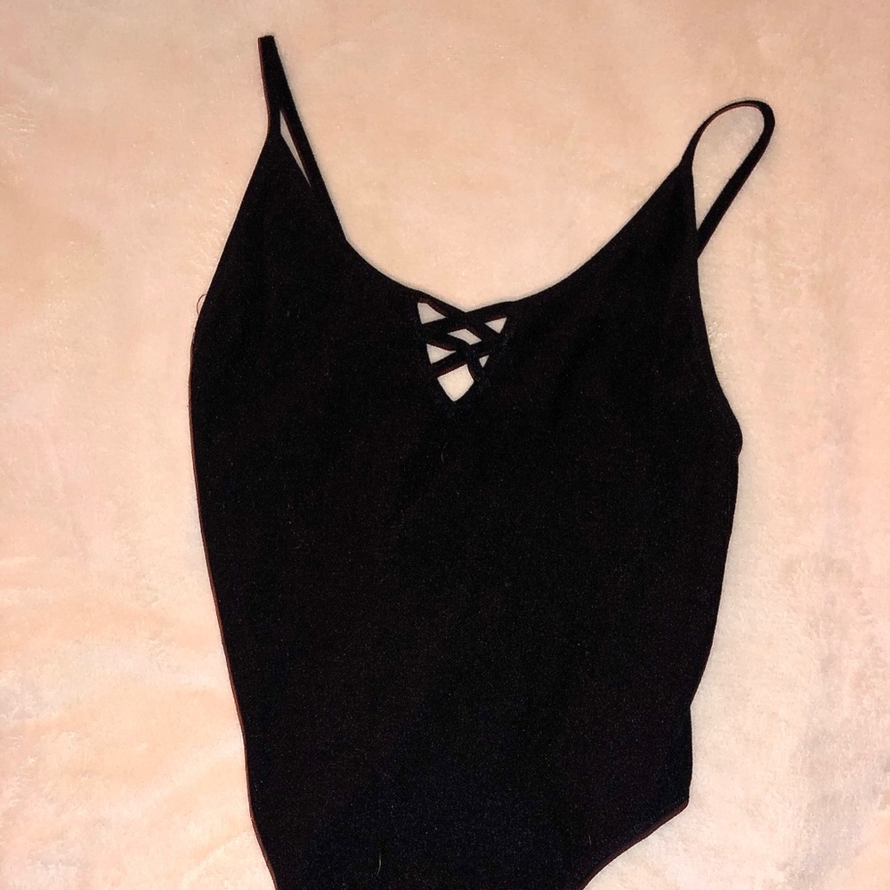 Stretchy, criss-cross neck, thong style, body suit